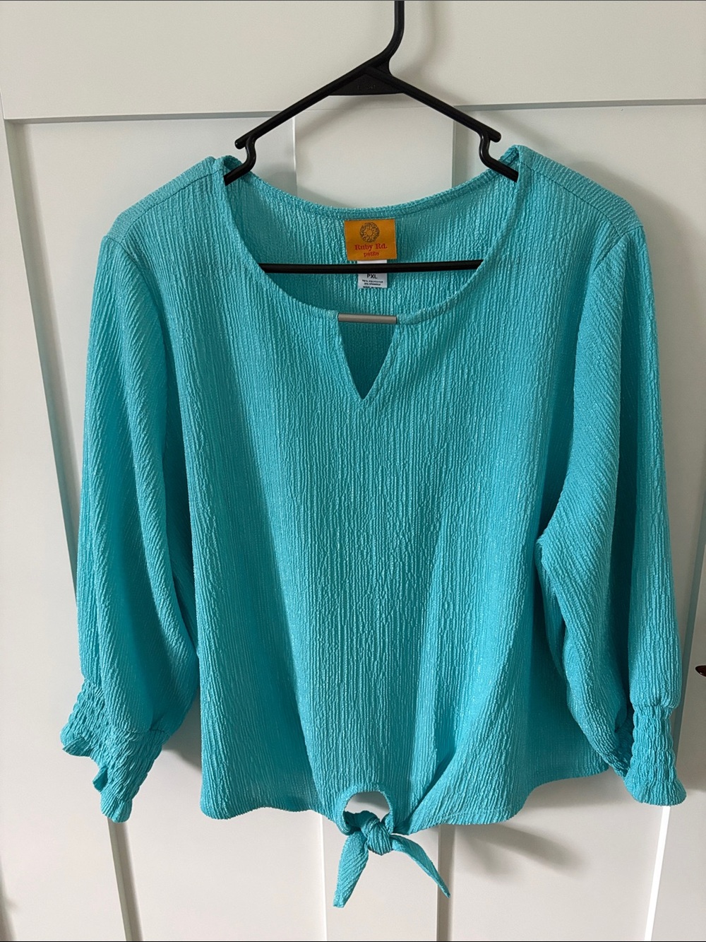 Women’s bright turquoise blouse